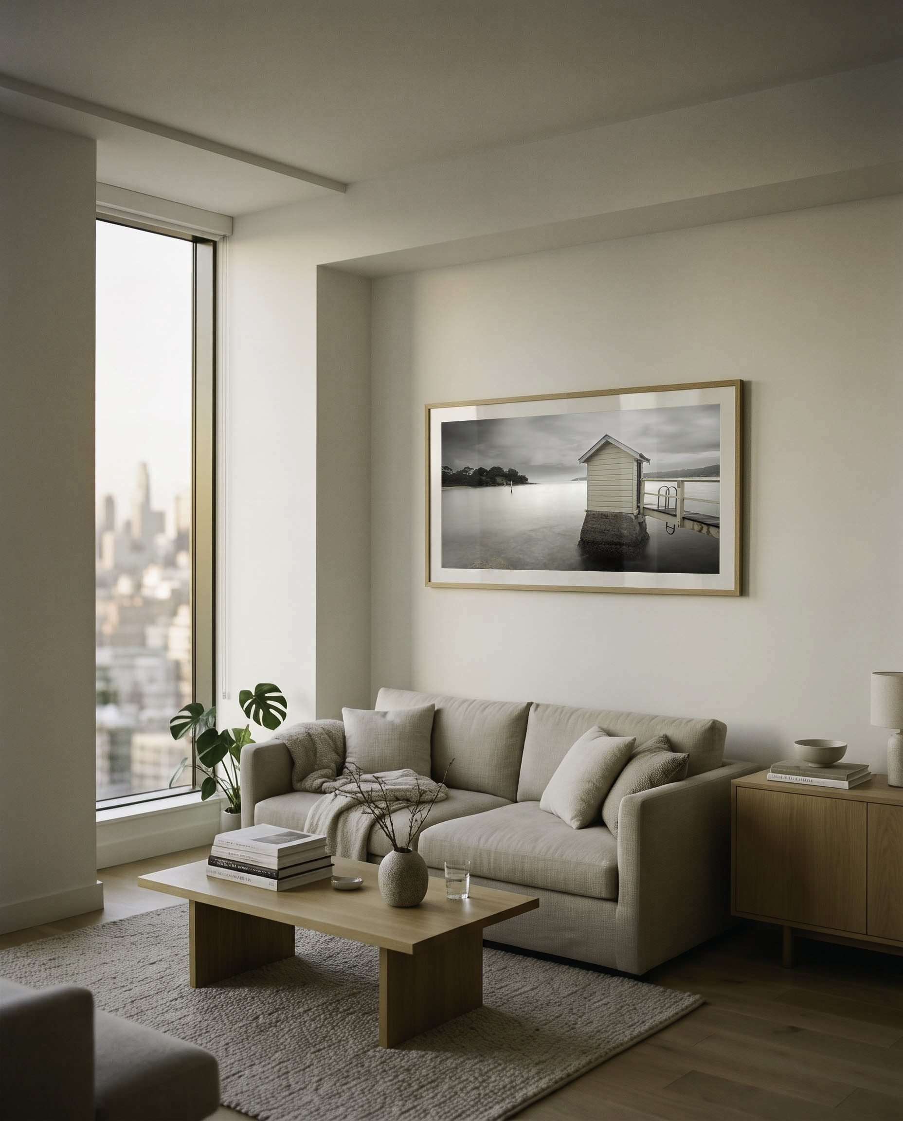 Harbour-view lounge with a panoramic framed print above the sofa.