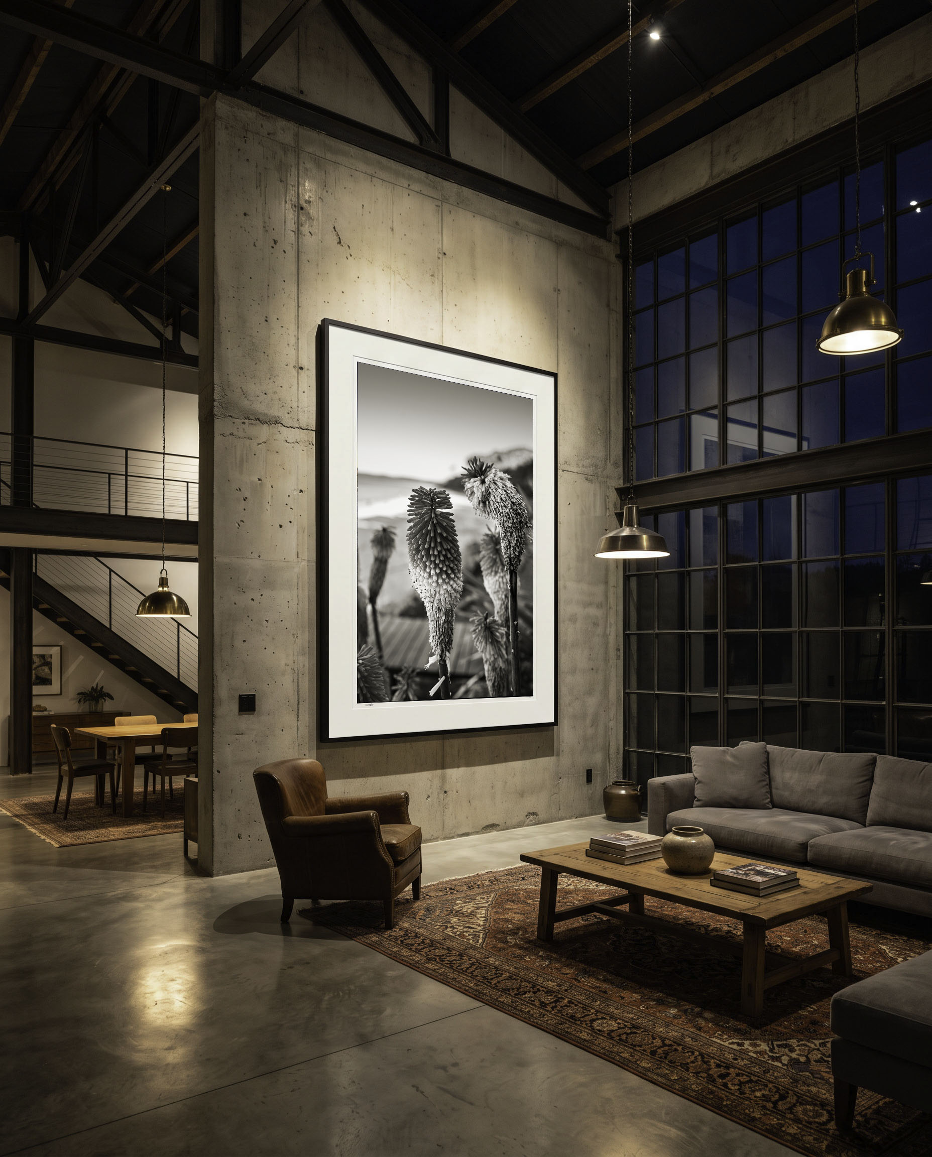 Warehouse-conversion lounge with a single large framed print.